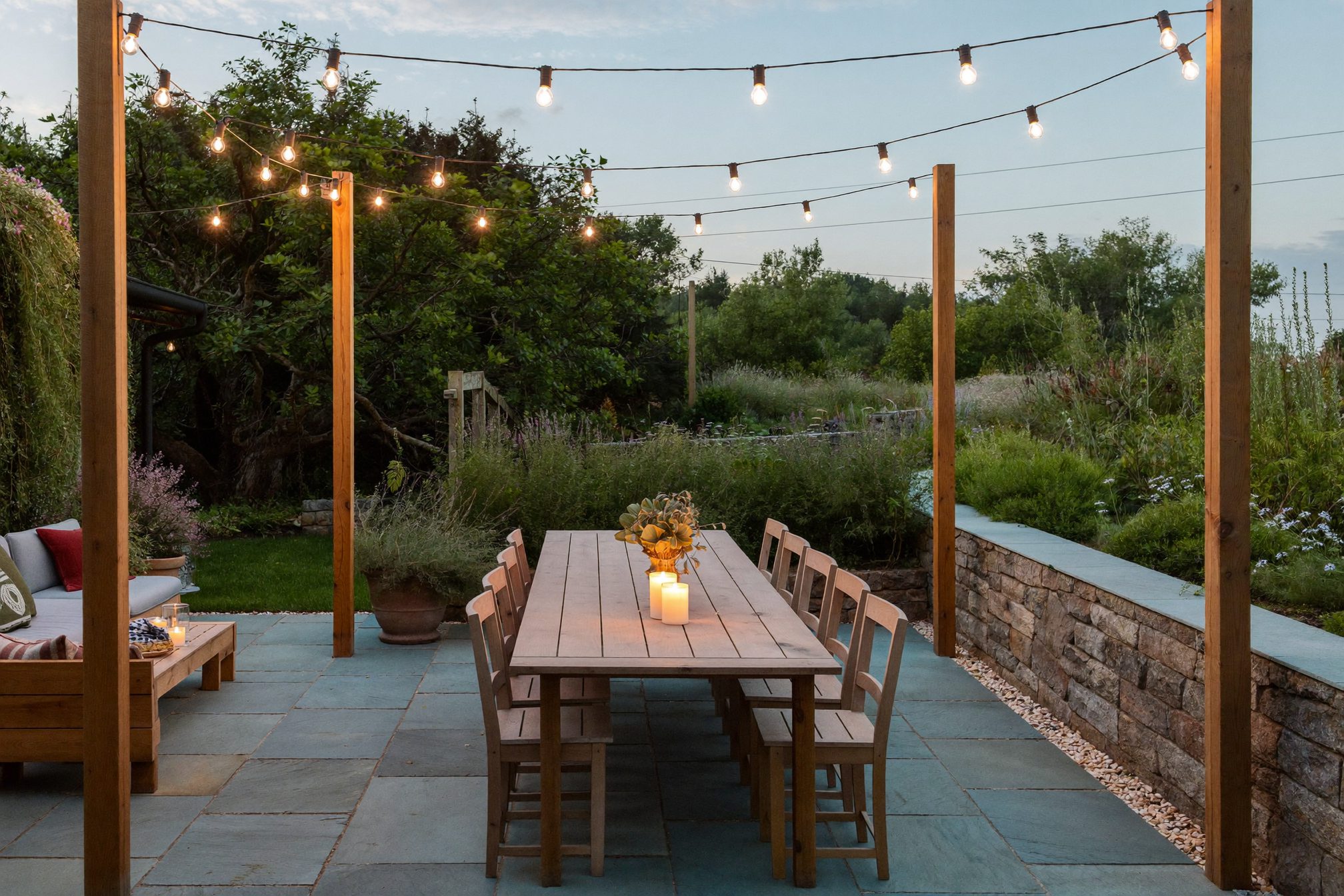 Outdoor dining patio under string lights